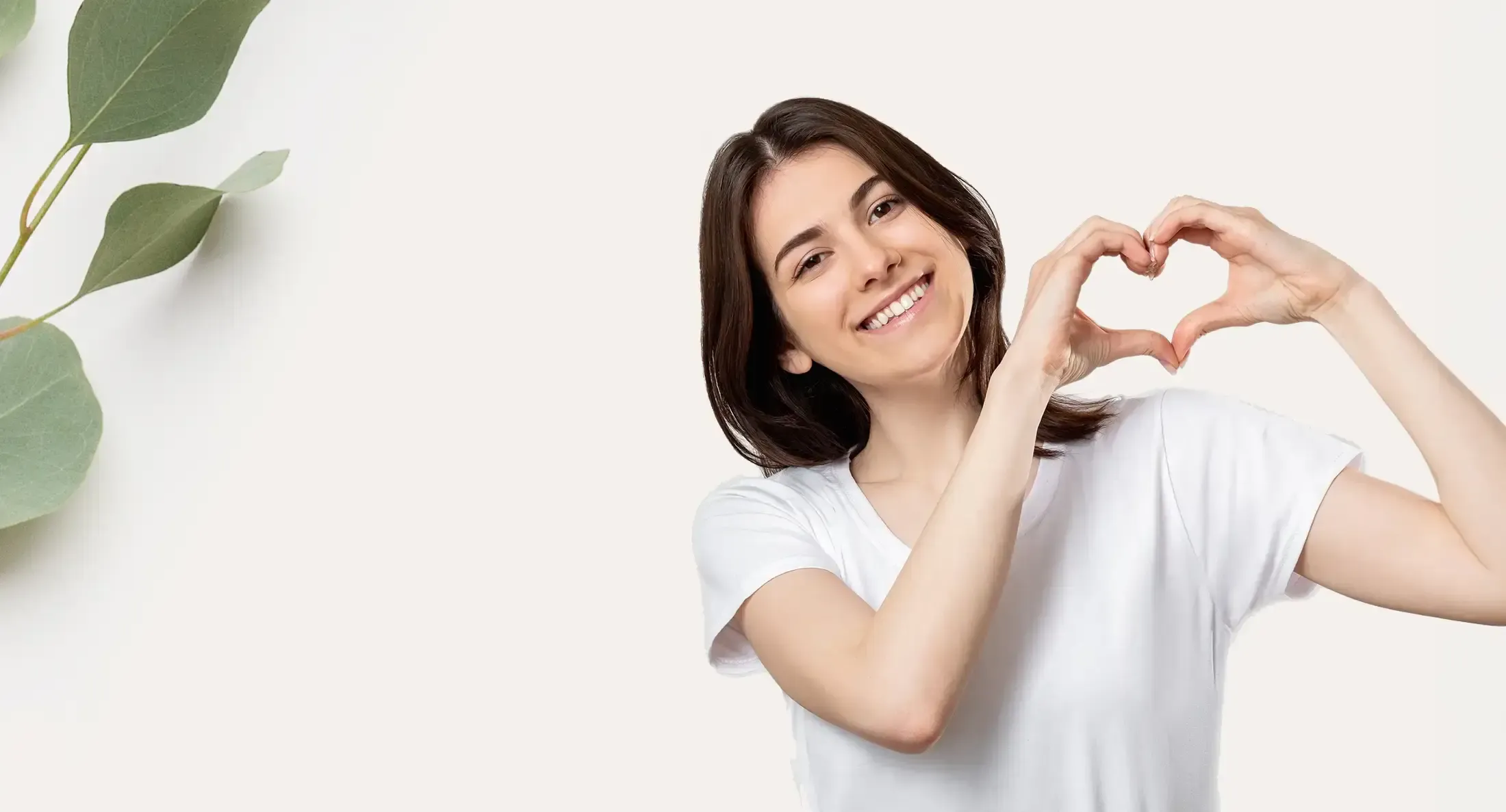 Woman forming a heart shape with her hands